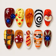ACEGRIP Clementine Spirals press-on nails in orange, yellow, red, and black, with spiral patterns, style AN8020