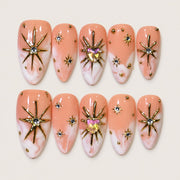 ACEGRIP Blush Starburst press-on nails in peach nude, pink, white, and gold tones, with starburst accents, style AN8035