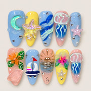 ACEGRIP Azure Seaside press-on nails in blue, yellow, pink, and cream, with ocean-inspired motifs, style AN8051