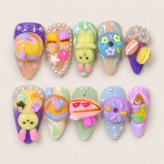 ACEGRIP Rose Candy press-on nails in pink, yellow, blue, and purple, with dessert and candy accents, style AN8060