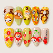 ACEGRIP Clementine Cherry press-on nails in orange, yellow, green, and peach nude, with cherry motifs, style AN8083
