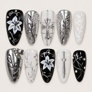 ACEGRIP Onyx Petals press-on nails in black, white, and silver tones, with floral accents, style AN8092