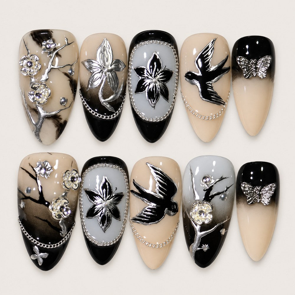 ACEGRIP Blush Birdsong press-on nails in peach nude, black, and silver tones, with bird motifs, style AN8119