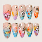 ACEGRIP Blush Petal Fish Tales press-on nails in peach nude, blue, pink, and orange, with floral accents, style AN8121