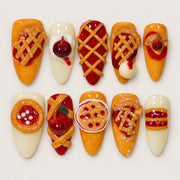 ACEGRIP Clementine Patisserie press-on nails in orange, cream, red, and brown, with pastry-shaped accents, style DC6022