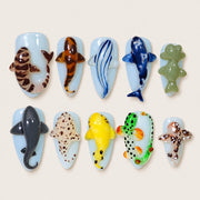 ACEGRIP Azure Seaside Fish Tales press-on nails in blue, white, green, and yellow, with ocean-inspired motifs, style DX7018