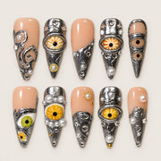 ACEGRIP Blush Gaze press-on nails in peach nude, silver tones, and yellow, with eye motifs, style DX7019