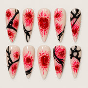 ACEGRIP Blush Bloom Branches press-on nails in peach nude, white, red, and black, with floral accents, style DX7035