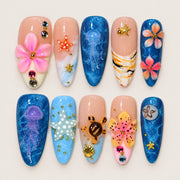 ACEGRIP Blush Petal Seaside press-on nails in peach nude, blue, pink, and white, with floral accents, style DX7106