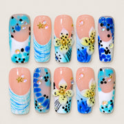 ACEGRIP Blush Petal Spotted press-on nails in peach nude, blue, yellow, and black, with floral accents, style DX7113