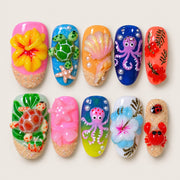 ACEGRIP Rose Coast press-on nails in pink, orange, blue, and green, with ocean-inspired motifs, style FD9014