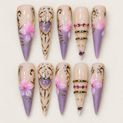 ACEGRIP Blush Petal Cameo press-on nails in peach nude, purple, and gold tones, with floral accents, style FD9019