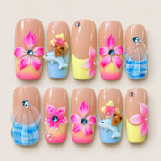 ACEGRIP Blush Bloom Seaside press-on nails in peach nude, pink, yellow, and blue, with floral accents, style FD9026