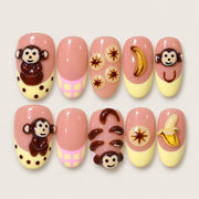 ACEGRIP Blush Monkey Banana press-on nails in peach nude, brown, yellow, and pink, with monkey motifs, style FD9037