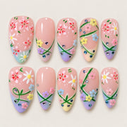 ACEGRIP Rose Petal Loops press-on nails in pink, blue, yellow, and green, with floral accents, style GH14003