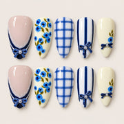ACEGRIP Blush Petal Bow press-on nails in peach nude, cream, blue, and navy blue, with floral accents, style GH14027