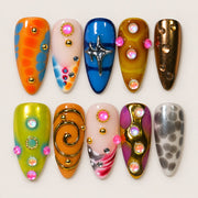 ACEGRIP Clementine Starlight press-on nails in orange, peach nude, blue, and gold tones, with star motifs, style HM5025