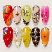 ACEGRIP Blush Starlight Spirals press-on nails in peach nude, orange, green, and pink, with star motifs, style HM5032