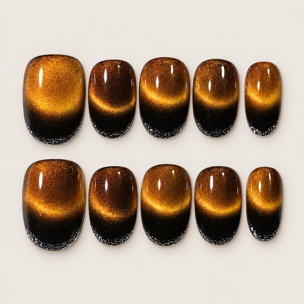ACEGRIP Onyx Glow press-on nails in black, brown, and gold tones, with a shimmering finish, style XH3004