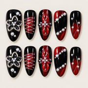 ACEGRIP Onyx Blossoms press-on nails in black, red, silver tones, and white, with floral accents, style XH3055